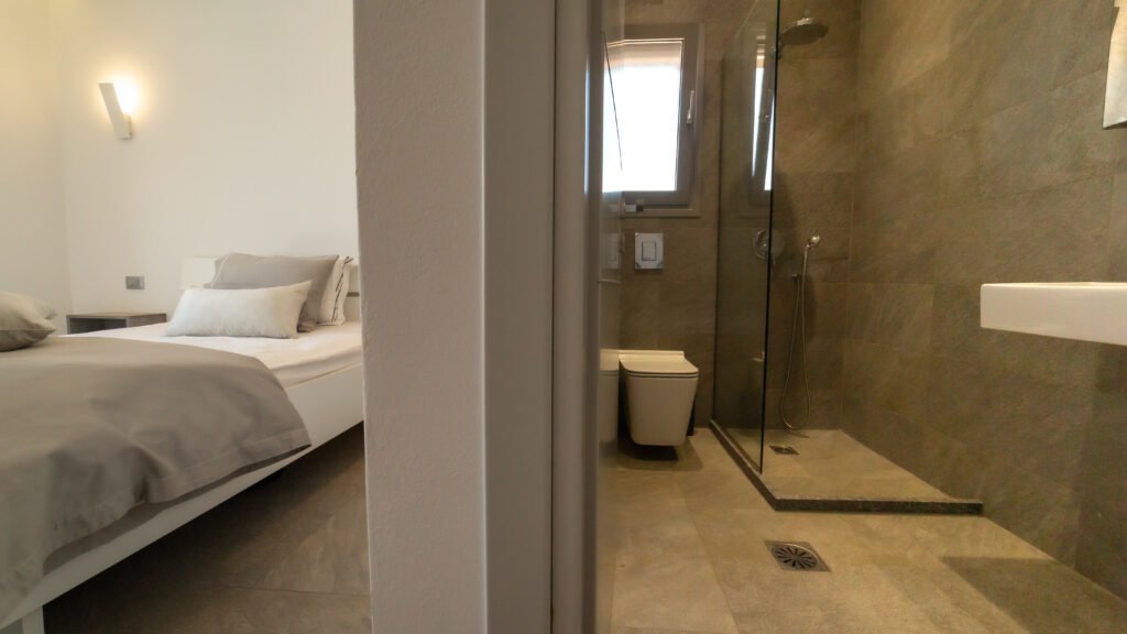 Gallery image depicting split view of bedroom and bathroom